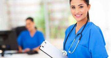 young intern nurse holding a clipboard